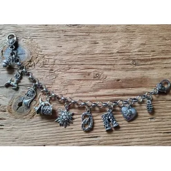 1 Damen - Charivari, 9 Anhänger, antik-silberfarben, ca. 24,5 cm