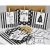 Adventskalender DIY mit Kraftpapiertüten, Zahlen und Holzklammern mir grafischen Motiven