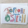 bunte Karte, FROHE OSTERN und Hase mit Blumenstrauß, Klappkarte DinA 6, mit weißem Umschlag.