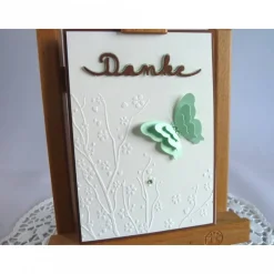 Dankekarte mit Hintergrundprägung und Schmetterling
