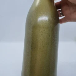 Dekorative Flasche in Kupfer mit Glitzereffekt. Perfekte Tischdekoration für die nächste Feier.