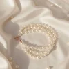 Dreireihiges Perlenarmband Champagner – Handgefertigt & Elegant | Pearl Embrace