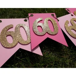 Edle Girlande zum 60. Geburtstag in Pink, Rosa und Gold. Trendige Farben mit glitzernden Zahlen. Geburtstagsdeko Partyde