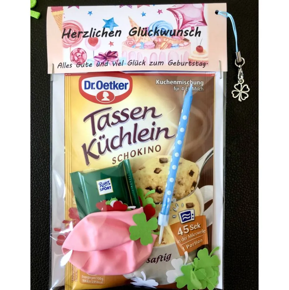 Geburtstagsgeschenktüte, Kuchenmischung verpackt mit Kerze, Konfetti und Luftballon, Geburtstagsüberraschung