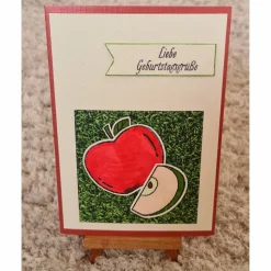Geburtstagskarte " Liebe Geburtstagsgrüße " roter Apfel mit Apfelscheibe