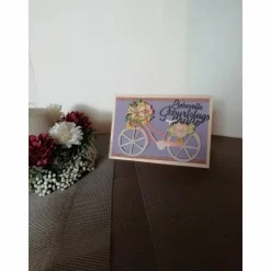 Geburtstagskarte für eine Frau mit einem lachsfarbenen Fahrrad