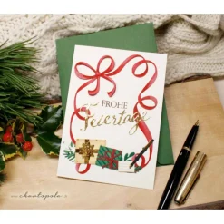 gemütliche Weihnachtsgrüße mit roter Schleife, handgemacht