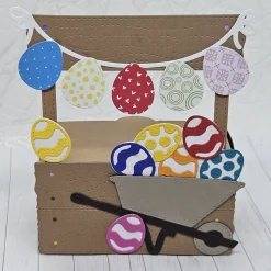 Geschenkbox Oster-Wichtel | Handgefertigt | Schubkarre & bunte Eier | Box für Geld & Gutscheine | Abnehmbarer Anhänger