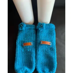 Gestrickte Socke als Verpackung für Flaschen