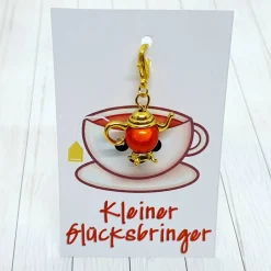 Glücksbringer Kanne goldfarben orange – niedlicher Anhänger für Heißgetränkliebhaber