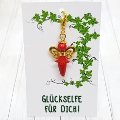 Glücksbringer Schmetterlingselfe goldfarben/rot – Zauberhafter Anhänger mit Schmuckkärtchen