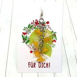 Glücksbringer Taschenbaumler Zarte Blumen orange – handgemachter Anhänger für Taschen & Rucksäcke