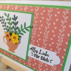 Glückwunschkarte mit Blättern und Blumen