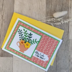 Glückwunschkarte mit Blättern und Blumen