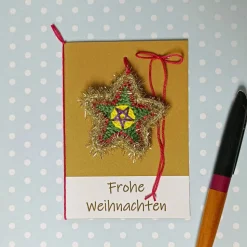 Grußkarte Weihnachten glitzernder Stern gehäkelt mit Wunschtext