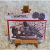 Gutscheinverpackung " Winter " Tannenzapfen , Schlitten , Holz , Axt