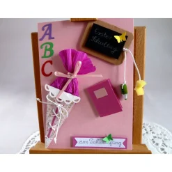 Karte zur Einschulung in rosa/pink für ein Mädchen, mit Tafel Schultüte und Malheft