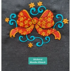 Kleine Stofftasche, mit Weihnachtsschleife bestickt