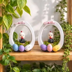 Osterdekoration - Osterei mit Schleife und Osterküken