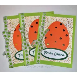 Osterkarte grün mit orangefarbenem Osterei, Schleife & Umschlag – frühlingshafte Faltkarte