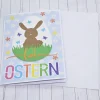 Osterkarte Hase im Ei bunt – Fröhliche Ostergrüße mit Blumen & Umschlag