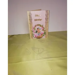 Osterkarte in rosa mit einem Osterkorb