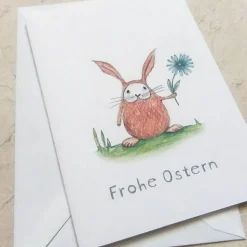 Osterkarte, Klappkarte DinA 6 mit Umschlag, kleiner Hase mit Blume und Frohe Ostern