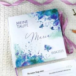 personalisiertes Gästebuch & Album zur Taufe mit Schmetterling & Blume in Türkis / Lila blanko o. mit Fragen