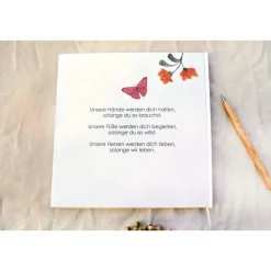 personalisiertes Gästebuch zur Taufe mit Blumenkranz aus Sommerblumen blanko o. mit Fragen / Fragebogen Beere