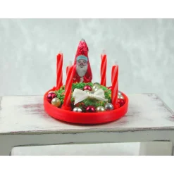 Roter  Teller mit Kerzenhalter  aus Kunststoff mit echten roten Kerzen