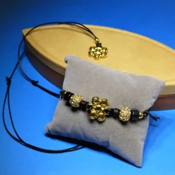 schichtes Schmuckset Blüte, gold schwarz, Halskette und Armband, mit Schiebeknoten, Metallperlen, Schmuck