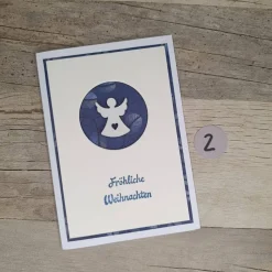 Schlichte Weihnachtskarten Engel in Weiß Blau mit Holzengel & Spruch