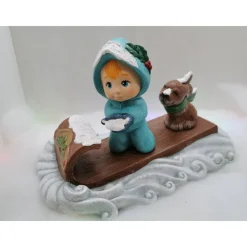 Schneemädchen mit Schlitten