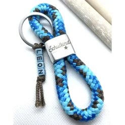 Schulkind Schlüsselanhänger aus Segelseil, Zwischenstück: "Schulkind"; blau, türkisblau,braun