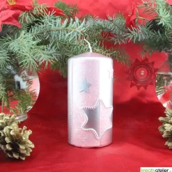 Silberne Weihnachtskerze mit rosafarbigem Stern