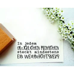 Stempeltext: "In jedem glücklichen Menschen steckt mindestens ein Weihnachtskeks"
