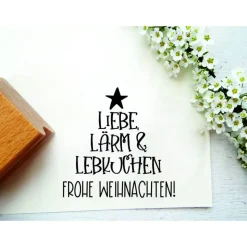 Stempeltext: "Liebe, Lärm & Lebkuchen. Frohe Weihnachten!"