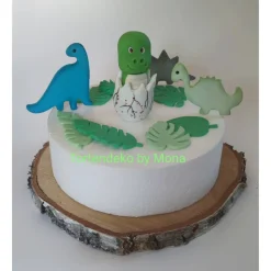 Tortendeko Dino aus den Ei  Urzeittier Tortenaufleger Fondantfigur Zuckerfigur