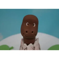 Tortendeko Dino aus den Ei  Urzeittier Tortenaufleger Fondantfigur Zuckerfigur