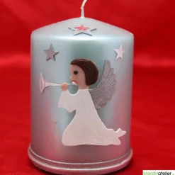 türkise Weihnachtskerze mit Trompetenengel