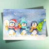 Weihnachtskarte Drei kleine Pinguine – Handillustrierte Aquarellkarte auf Kraftpapier
