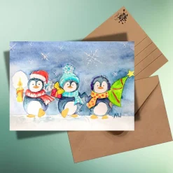 Weihnachtskarte Drei kleine Pinguine – Handillustrierte Aquarellkarte auf Kraftpapier