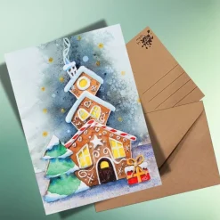 Weihnachtskarte Lebkuchenhaus – Handgemalte Aquarell-Postkarte auf Kraftpapier, winterlich & individuell