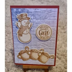 Weihnachtskarte mit Schneemann , heiße Schokolade