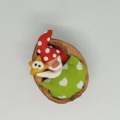 Wichtel im Walnussbettchen – Weihnachtsdeko aus Polymer Clay